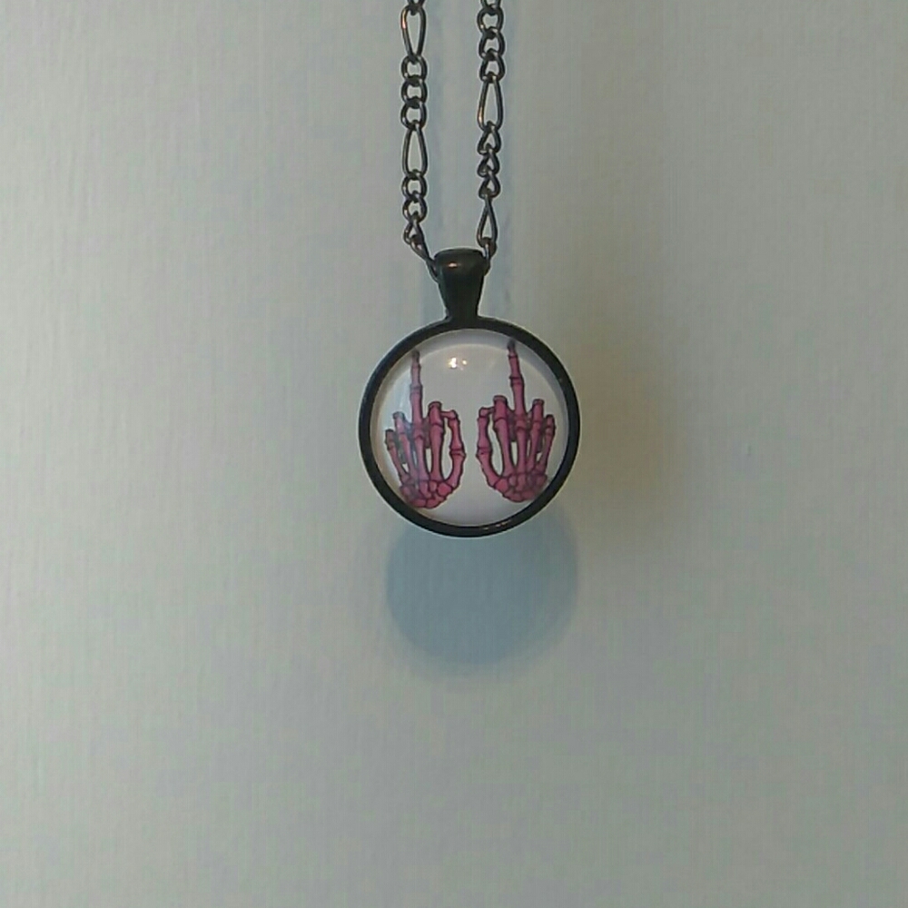Skeleton hands necklace.